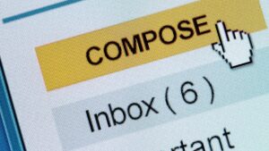 Computer screen with mouse pressing the yellow "compose" button